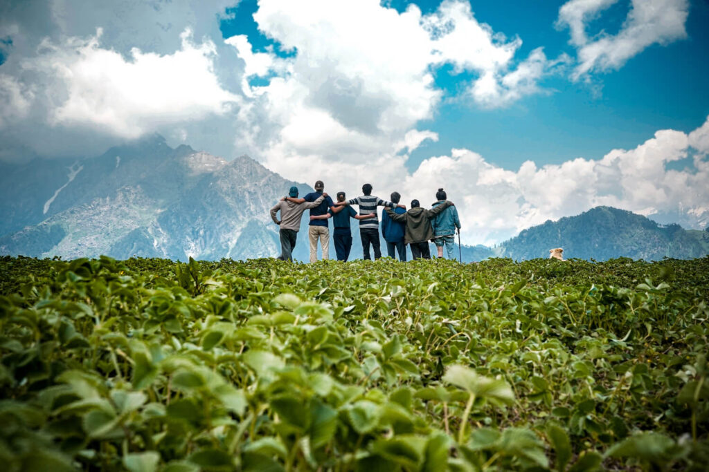 young friends top mountain enjoying mesmerizing