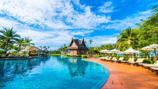 large pool with umbrellas hammocks