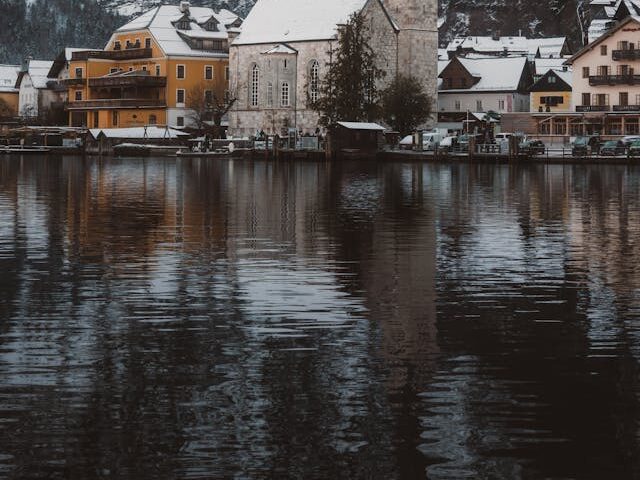 scenic winter village with snow covered mountains