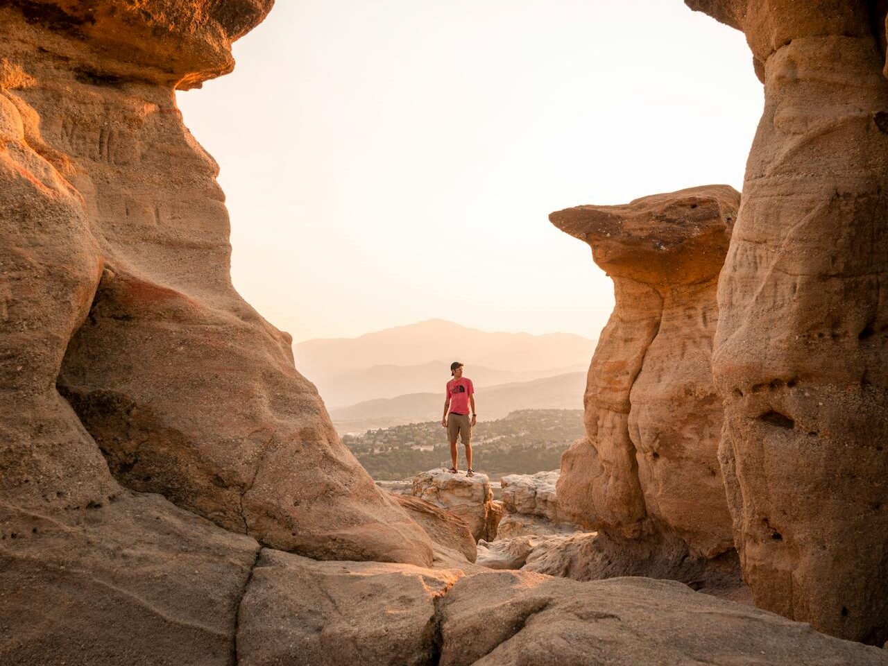 a person standing near the rock formations on pulpit rock in colorado springs colorado united states. Best Solo Female Travel Destinations