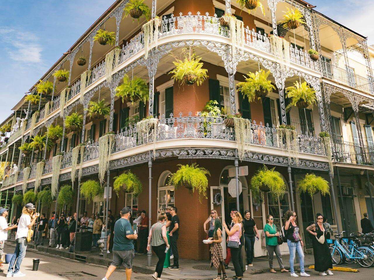 people walking down the street in front of a building