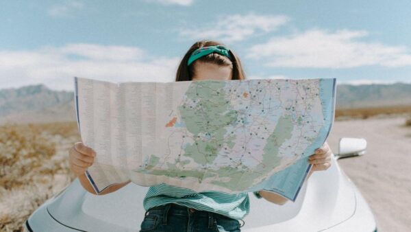 photo of a woman looking at the map