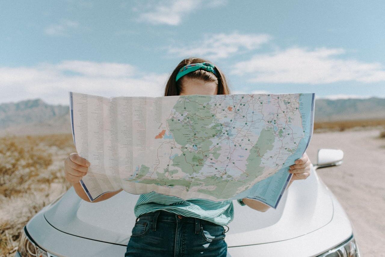 photo of a woman looking at the map