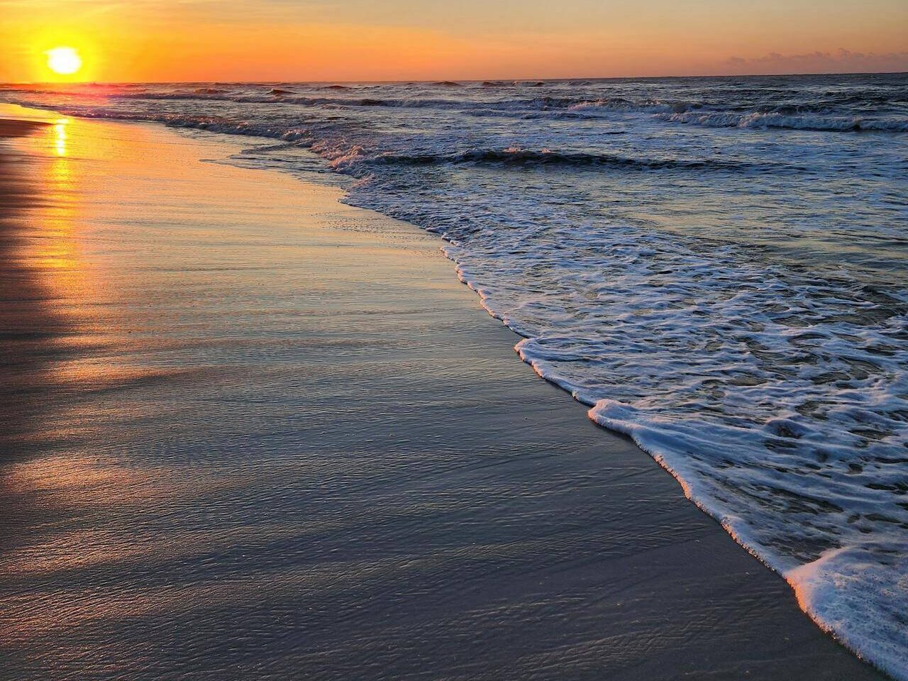 gulf shores beach sunset with ocean waves