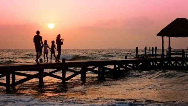 People Standing on Dock during Sunrise